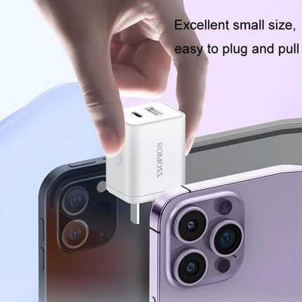 ROMOSS Charger for Daily Phone Use at Home or Travel compact dual-port wall charger being plugged into a phone for travel and home use