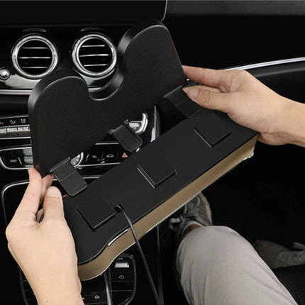 Car Seat Gap Storage Box With USB Charger In Black placed between car seats holding phone cables and charging devices