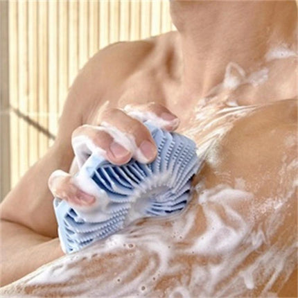 Soft Silicone Body Brush for Daily Shower Cleaning used to gently exfoliate and lather skin in the shower