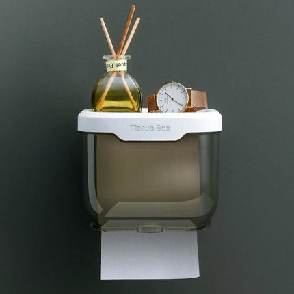 Bathroom Wall-Mounted Tissue Holder for Daily Organization mounted on wall with shelf holding watch and diffuser, toilet paper roll dispensing