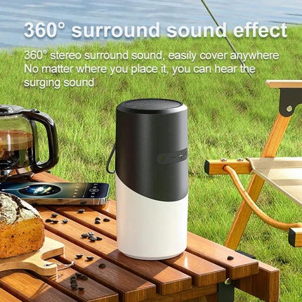 Bluetooth Speaker With Ambient Mood Lighting For Home Use on picnic table with phone coffee and chair showcasing 360° sound