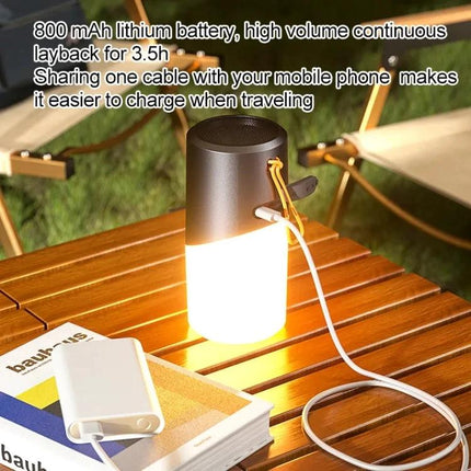 Bluetooth Speaker With Ambient Mood Lighting For Home Use on picnic table with charging cable and warm glow