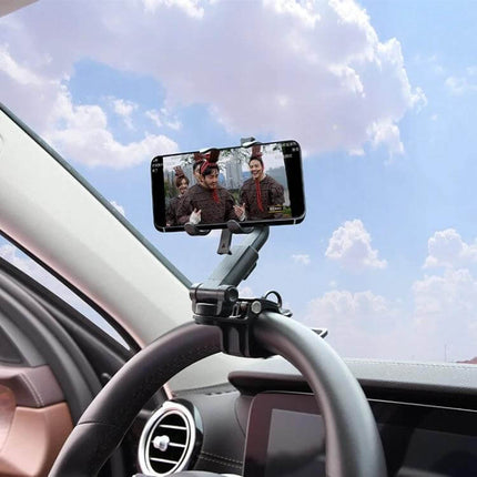 Car Sun Visor Clamp Phone Holder With Adjustable Rotating Mount clamped to visor with phone in landscape for hands-free navigation and calls