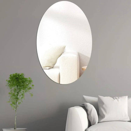 Oval Acrylic Mirror Wall Sticker For Living Room Decor 15x10cm mounted on grey wall reflecting sofa to brighten small spaces