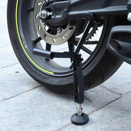 Foldable Motorcycle Lifting Frame for Rear Wheel Support showing iron rear-wheel support stand stabilizing motorcycle during maintenance