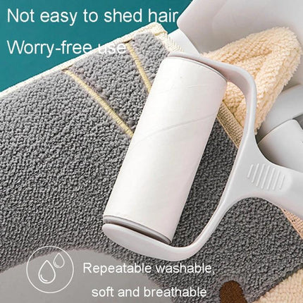 Soft Suede Toilet Seat Cover for Daily Bathroom Comfort shown on soft cotton velvet being lint-rolled for easy, repeatable washable care