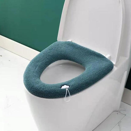 Cozy Knitted Toilet Cover for Daily Home Comfort on a white toilet seat, soft blue-green knitted seat cover, easy-install