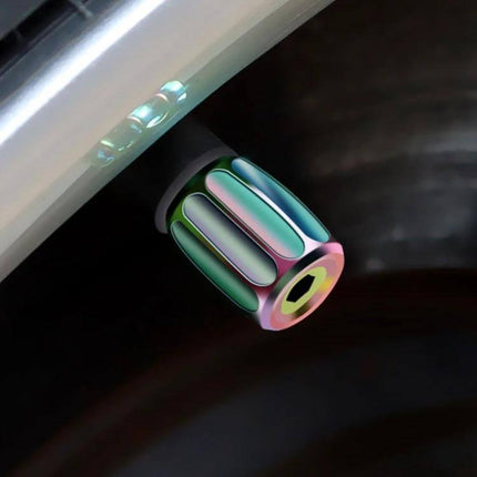 4-Pack Metal Anti-Theft Tyre Valve Core Caps, Multicolor installed on car wheel valve stem to protect against dust and theft