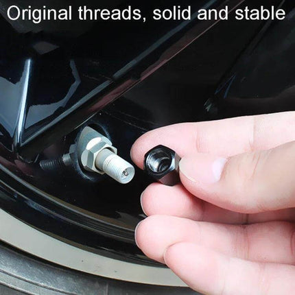 Skeleton Metal Tire Valve Caps For Cars 4 Piece Set - zinc alloy skeleton-style valve cap being hand-threaded onto car tire valve to protect stems