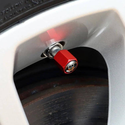 Skull Metal Tire Valve Caps Set of 4 Universal Aluminum red skull valve cap mounted on alloy wheel