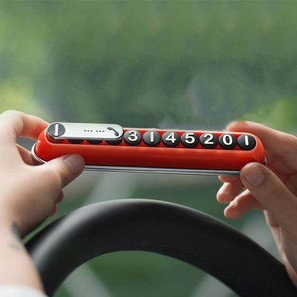Bbdd Pod Privacy Parking Plate For Hidden License Card compact ABS+PC privacy plate with molded 3D numbers shown in red mounted on dashboard