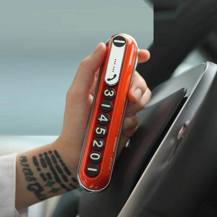 Bbdd Pod Privacy Parking Plate For Hidden License Card shown in hand, compact orange ABS+PC number plate with molded 3D digits for parking privacy