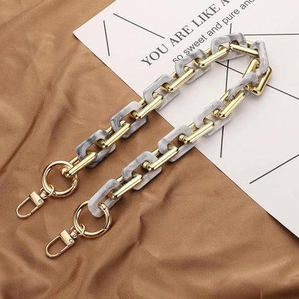 Retro Tortoiseshell Acrylic Phone Lanyard for Hands-Free Use - gold and marble chain phone lanyard laid on brown fabric