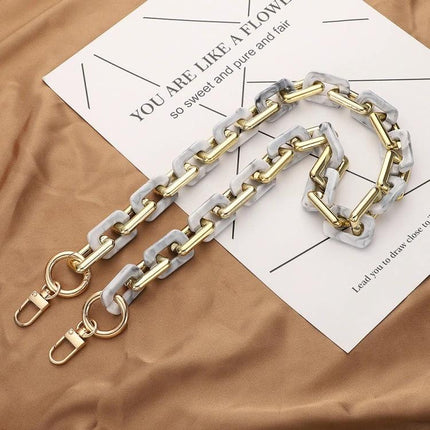 Retro Tortoiseshell Acrylic Phone Lanyard for Hands-Free Use - gold chain and marble acrylic links on fabric background