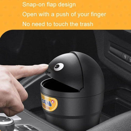 Universal Car Trash Can for Cup Holder Keeps Vehicle Clean on Road - black cup-shaped car trash can with snap-on flip lid in cup holder being opened by finger