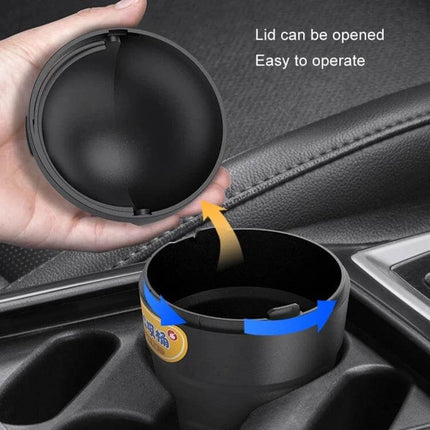 Universal Car Trash Can for Cup Holder Keeps Vehicle Clean on Road - black cup-shaped car trash can with snap-on flip lid in cup holder