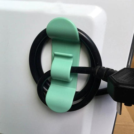 Kitchen Cord Organizer for Daily Appliance Storage mint ABS clip holding black appliance cord on white countertop to prevent tangles and clutter