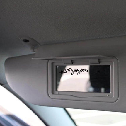 Hello Gorgeous Inverted Rear Mirror Glass Car Sticker applied to car sun visor mirror, black PVC inverted decal visible in mirror reflection