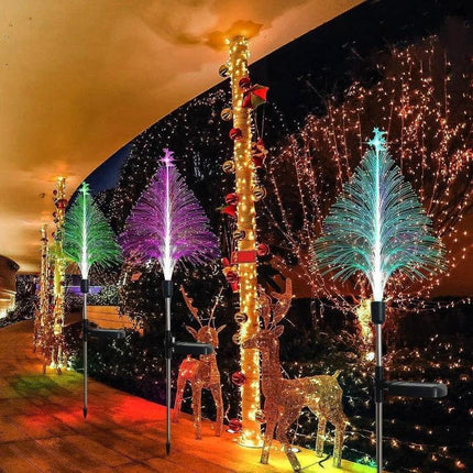 Christmas Tree Solar Light Star Moon Lamp For Outdoor Decor glowing multicolor fiber optic trees along walkway with reindeer and string lights