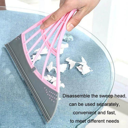 Magic Broom Soft Silicone Scraper Bathroom Wiper For Daily Cleanup - pink flexible silicone scraper removing paper debris from glass tabletop