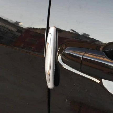 Car Door Anti-Collision Strips for Mirror Protection, 4-Piece Set installed on car door edge beside handle to prevent scratches and minor impacts