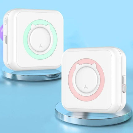 Mini Bluetooth Inkless Thermal Printer for Photos and Labels white compact portable photo and label printer with pastel green and pink accents