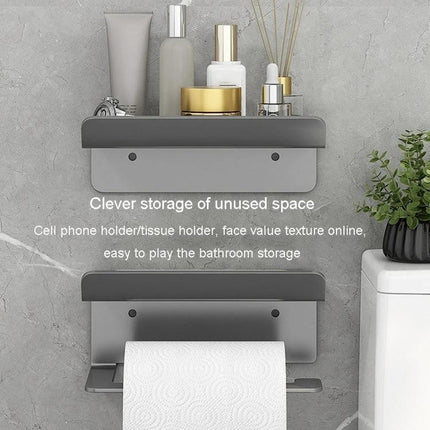 Practical Bathroom Shelf for Daily Paper and Phone Storage — wall-mounted gray shelf holding phone and toiletries above toilet paper