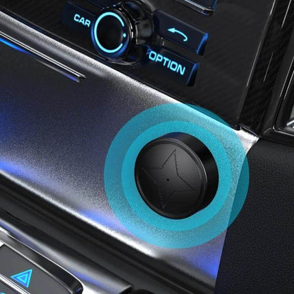 Wireless GPS Tracker with Magnetic Attachment for Pets and Elderly mounted on car dashboard near infotainment controls
