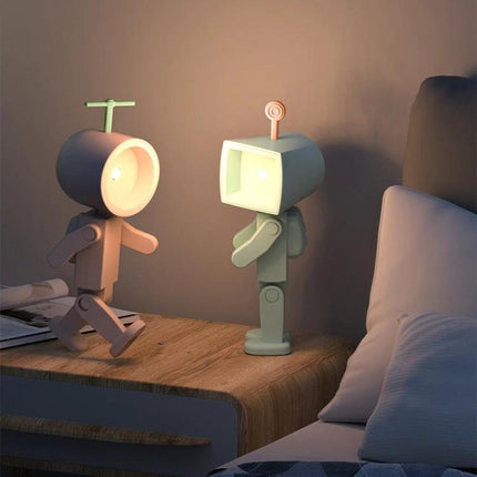 Compact Astronaut Night Light for Home Desk Decorations on wooden bedside table providing warm ambient glow and playful astronaut design