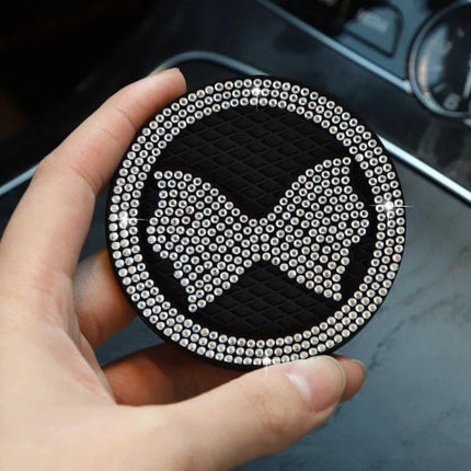 Car Multifunctional Anti Slip Coaster With Diamond Bow Crystal — black PVC non-slip car coaster with rhinestone bow, protects cup holders from spills and scratches