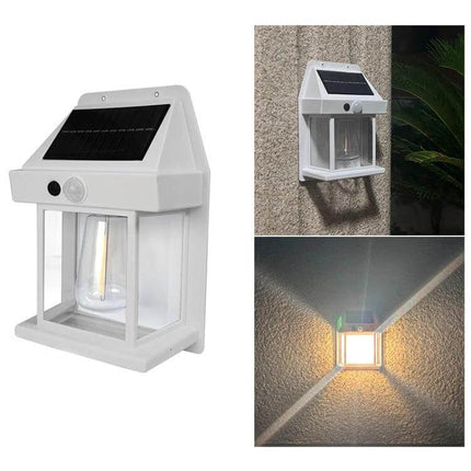 Solar Outdoor Tungsten Wall Light For Garden, Three Mode, Weatherproof mounted white ABS solar motion lamp on exterior wall, warm LED glow