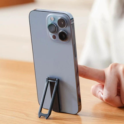 Mini Foldable Back-Mounted Holder for Phones and Tablets mounted on phone as compact kickstand for hands-free video calls and viewing