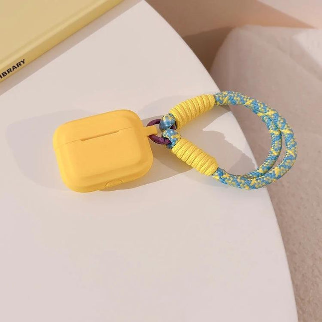 Protect Your AirPods During Daily Activities With Silicone Cover - yellow silicone AirPods case with braided wrist strap