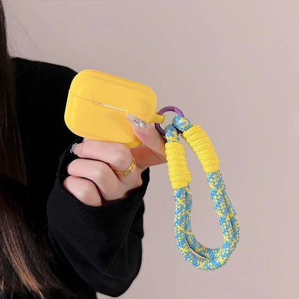 Protect Your AirPods During Daily Activities With Silicone Cover - yellow silicone AirPods case with braided wrist strap