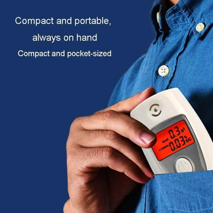 Compact Portable Breathalyzer for Alcohol Testing and Safety being placed into a shirt pocket to show compact and portable design