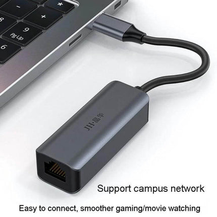 JINGHUA Gigabit LAN Converter for Computer Network Connections plugged into laptop USB Type-C port showing Ethernet adapter for stable gaming and streaming