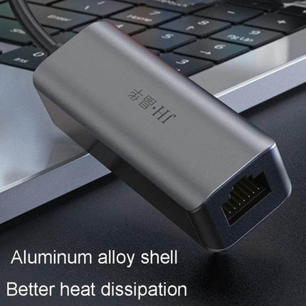 JINGHUA Gigabit LAN Converter for Computer Network Connections plugged into laptop USB Type-C port showing Ethernet port and aluminum alloy shell