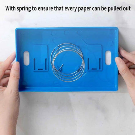 Building Block Tissue Box Wall Mount For Living Room - blue ABS plastic wall-mounted tissue holder with spring inside, hands showing mounting slots