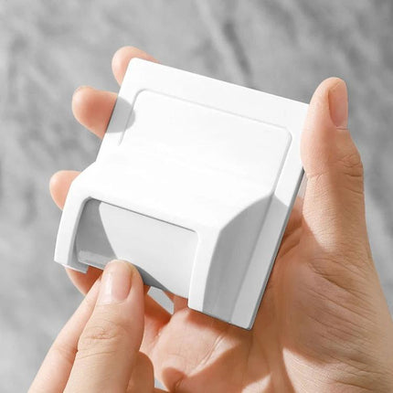 A Practical Bathroom Drain Guard for Everyday Pest Prevention held in hand showing compact white drain cover