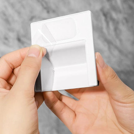 A Practical Bathroom Drain Guard for Everyday Pest Prevention — hands applying a white adhesive drain cover to prevent cockroaches and sewage backflow