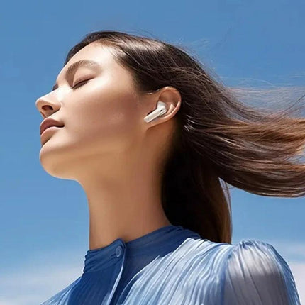REMAX CozyPods Earbuds With Noise Reduction For Work, woman outdoors wearing white wireless earbuds, clear bass and dual noise reduction