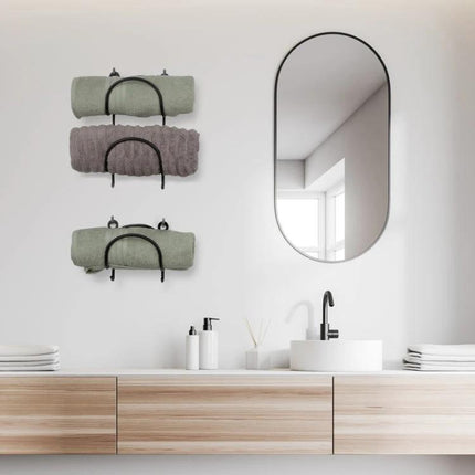 Wall Mounted Shelf for Organizing Bathroom Essentials Daily in wrought iron holding rolled towels above a modern vanity mirror