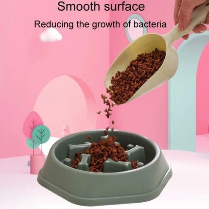 Essential Bone-Shaped Bowl for Daily Dog Meals at Home - green PP slow-feed bone-shaped bowl with dry kibble being poured from scoop