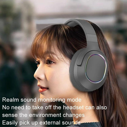 SOYTO Bluetooth Wireless Headset With Ambient Awareness For Calls shown on woman wearing over-ear headset with ambient mode