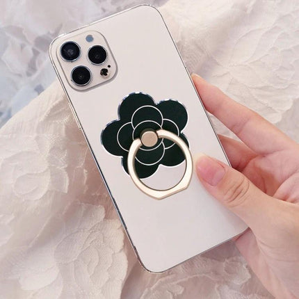 Metal Rotatable Finger Ring Holder for Phones and Tablets on white iPhone with black floral backing, 360° rotatable aluminum zinc alloy ring