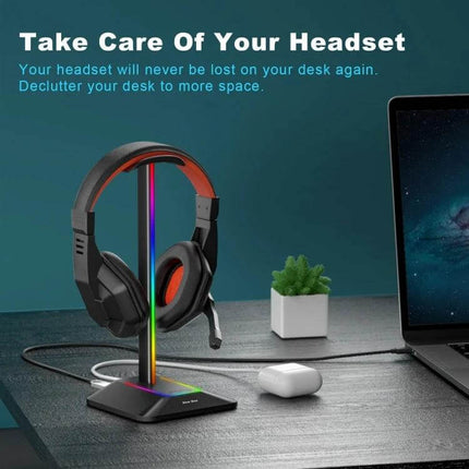 Headphone Holder With Built In USB Ports For Desk Organizer displayed on desk holding headset with LED strip and charging ports