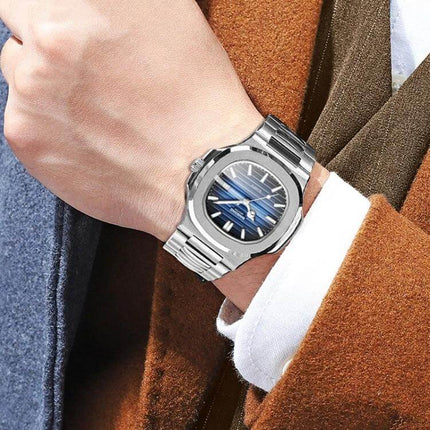 Binbond Men's Retro Luminous Square Quartz Watch in Various Colors shown on wrist with silver square metal case and steel strap, luminous blue dial for low-light visibility