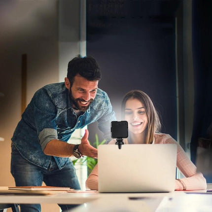 Essential Clip-On Light for Remote Work Video Calls clipped to laptop improving face lighting for virtual meetings