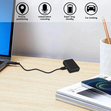 Portable Voice-Activated Anti-Theft Alarm Locator Device placed on desk near laptop and phone, showing precise positioning, recording, long standby and car tracking features