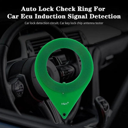 Essential Card for Routine Car Lock System Checks green plastic lock ring tester placed over car steering wheel to check anti-theft chip sensor